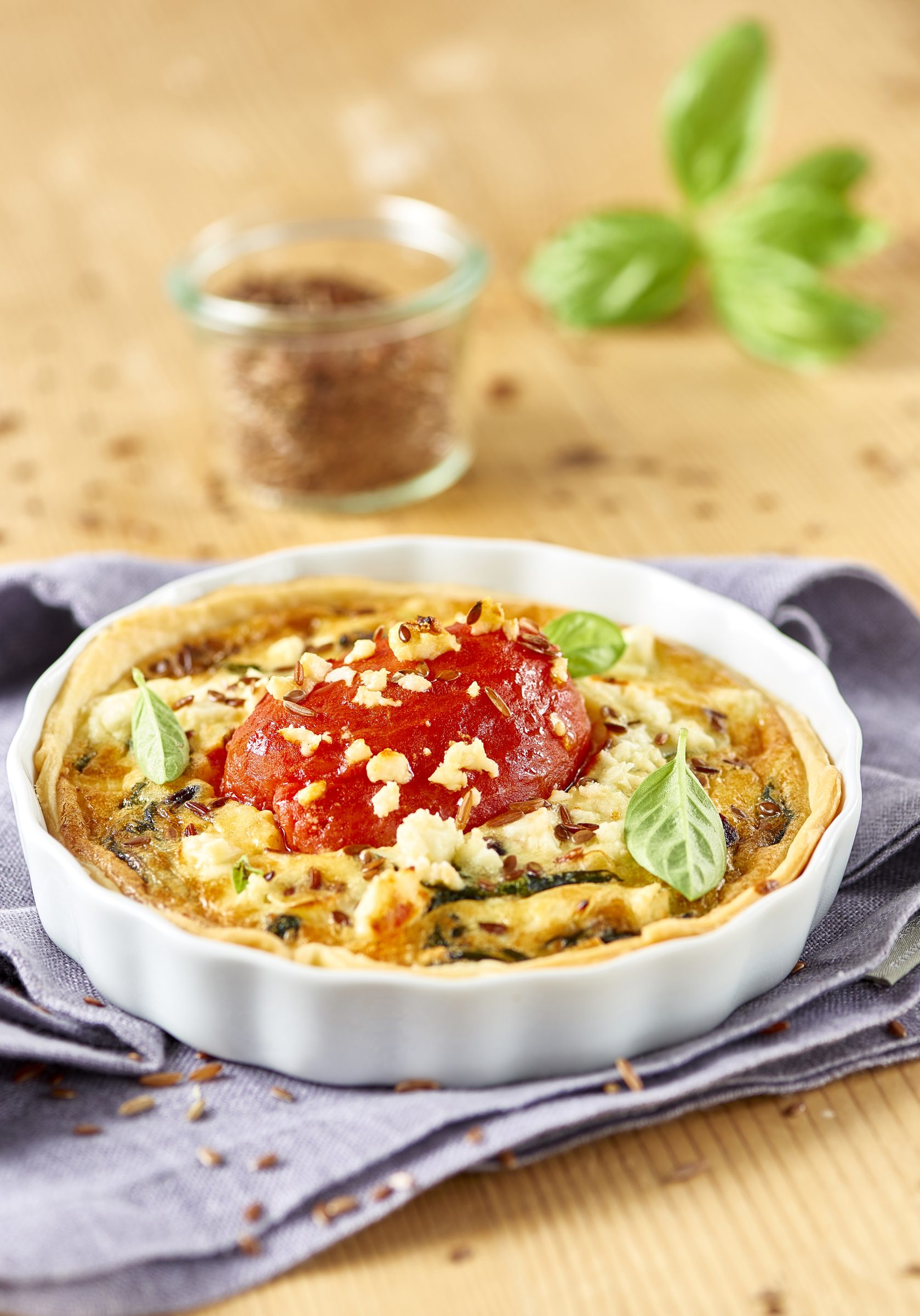 Feta and spinach quiche with peeled tomatoes