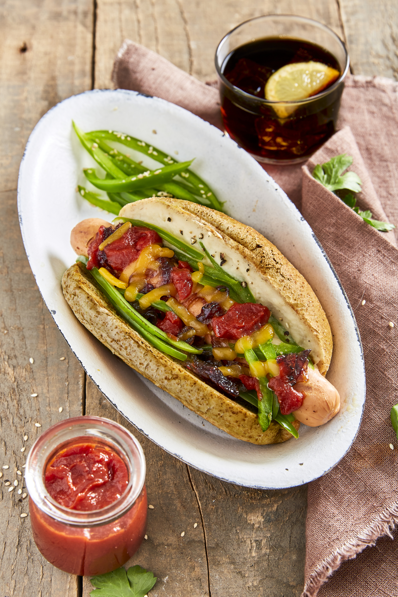 Gourmet hot dogs with cannellini sauce, sliced green pepper, caramelized red onions, shredded cheese and ketchup | Mutti Recipe
