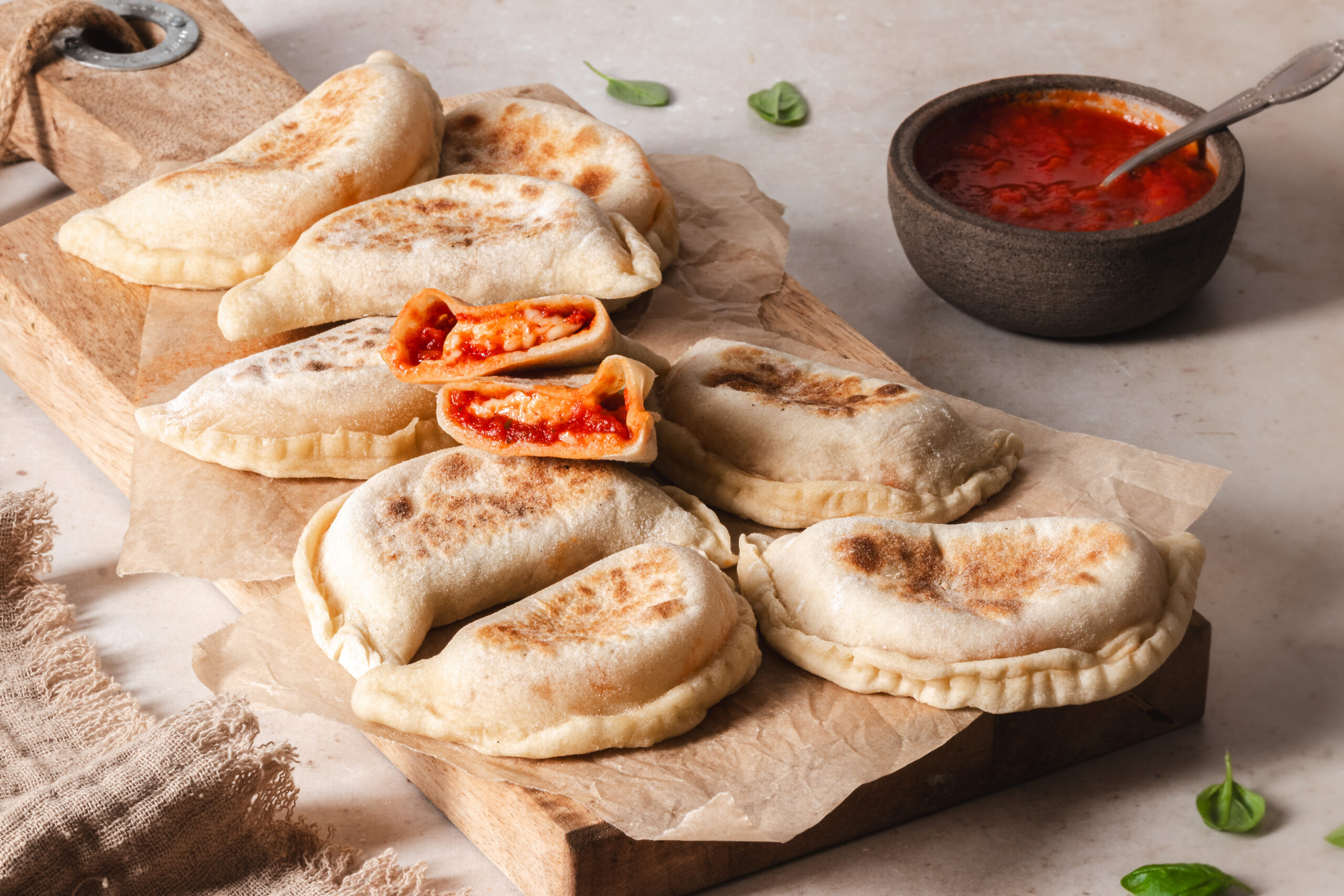 Italian homemade panzerotti with tomato and basil sauce