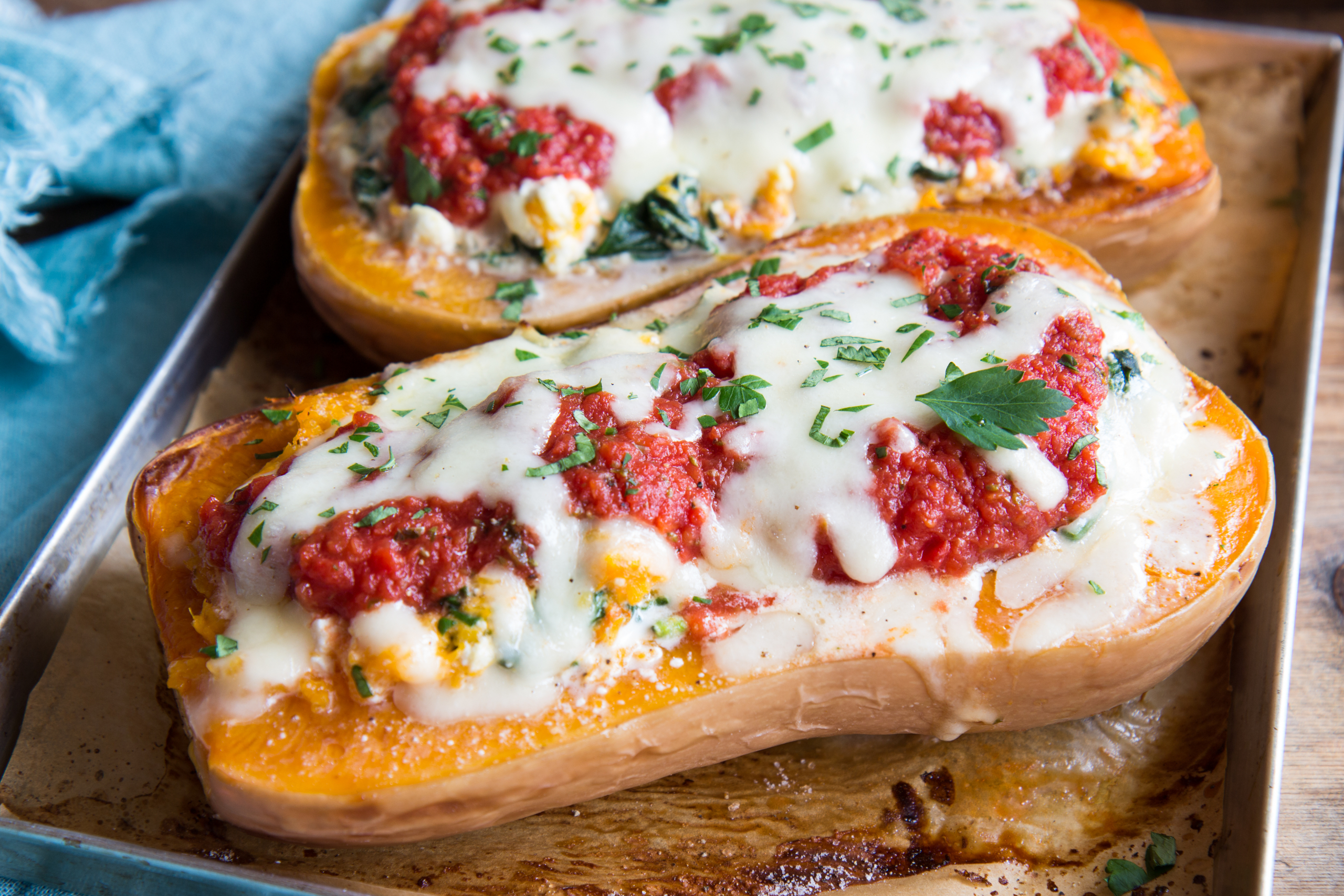 Stuffed butternut squash with tomato sauce