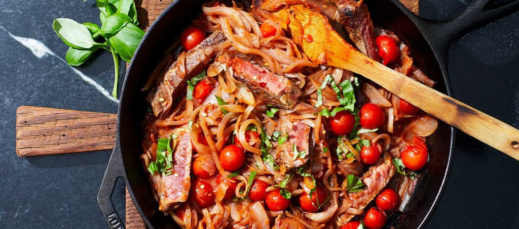 Pan-Seared Steaks with Tomatoes & Onions Pan-Seared Steaks with Tomatoes & Onions