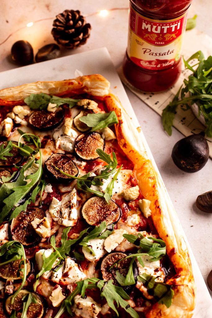Tomato puff pastry tart with ricotta, figs, balsamic glaze, rocket leaves and roasted chestnuts Tomato puff pastry tart with ricotta, figs, balsamic glaze, rocket leaves and roasted chestnuts
