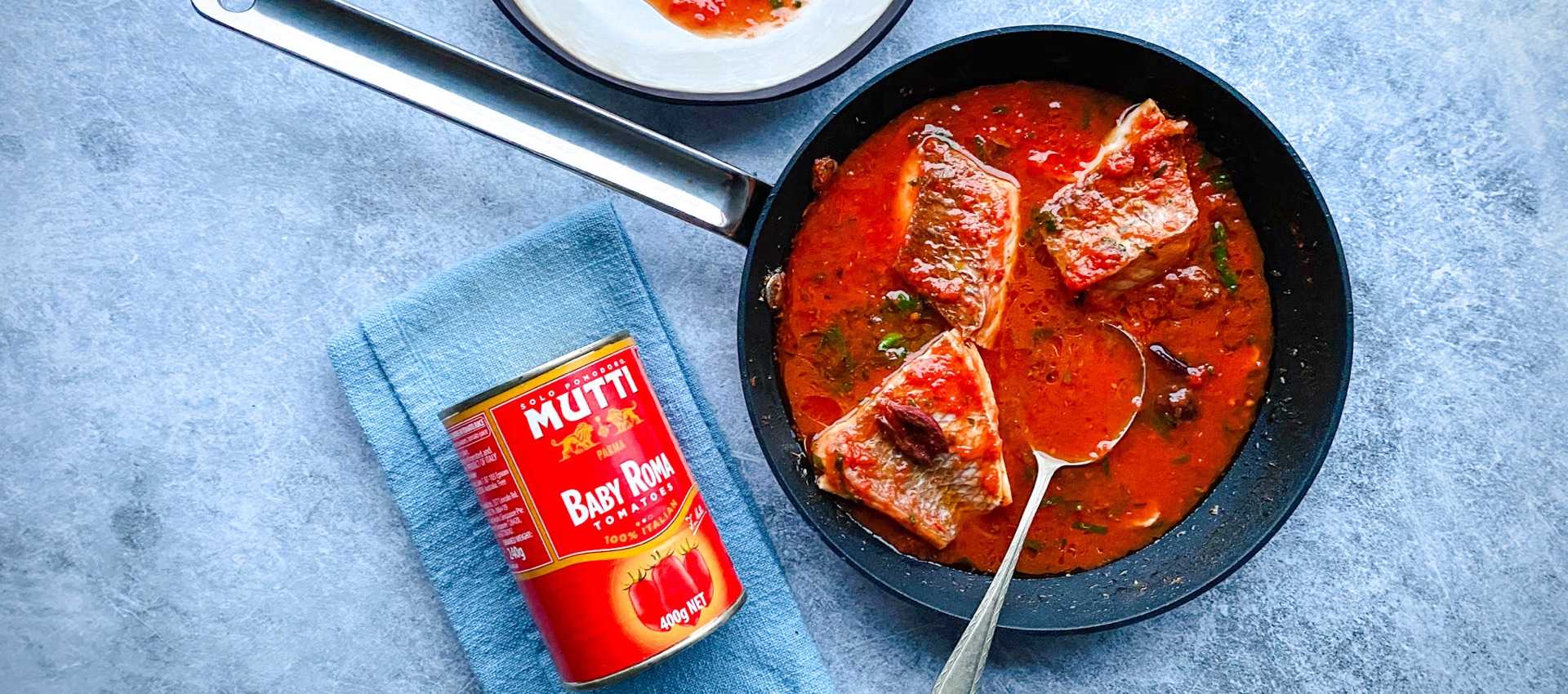 Snapper acqua pazza with baby Roma tomatoes