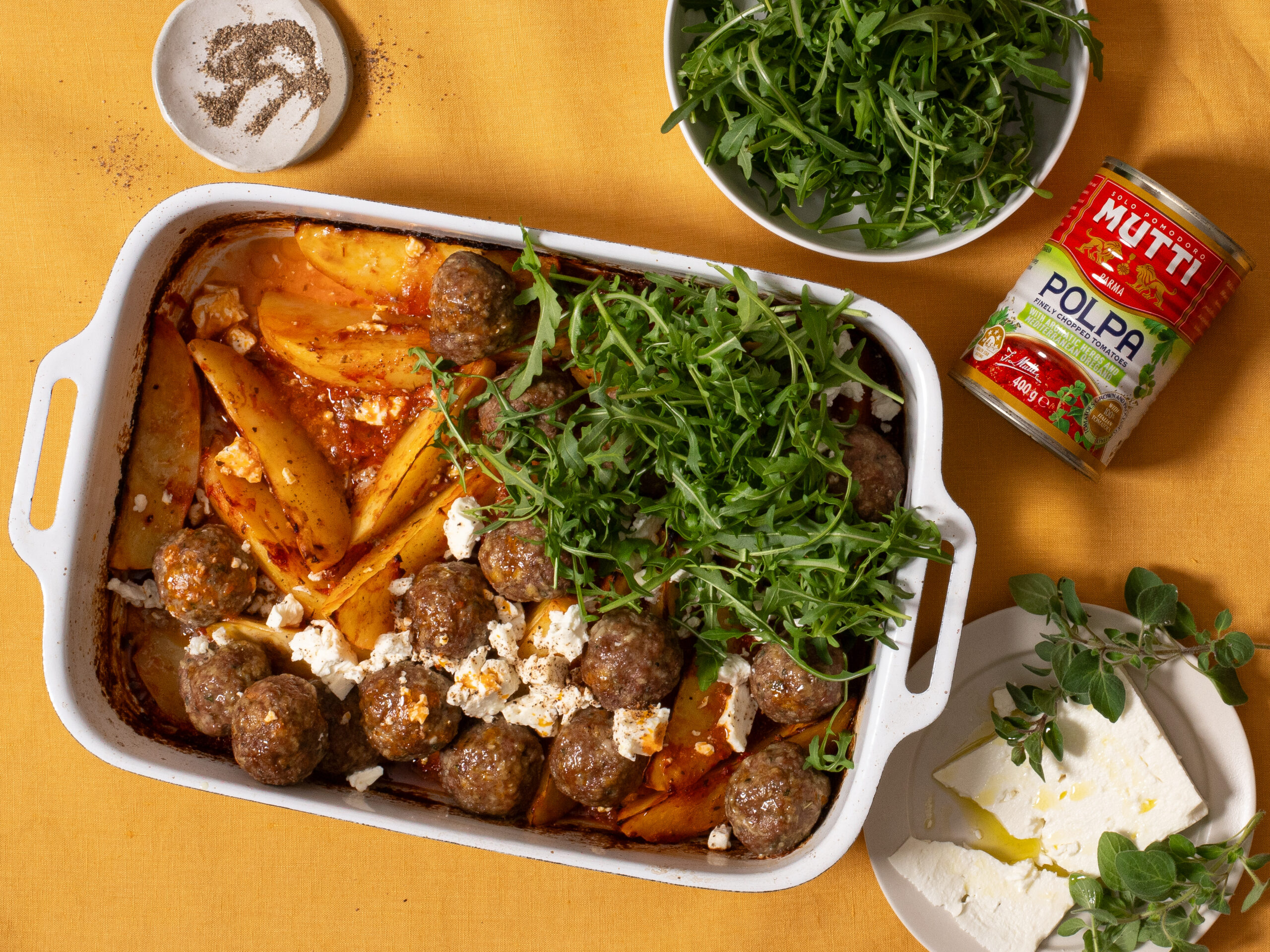 Greek lamb meatball and potato one tray bake