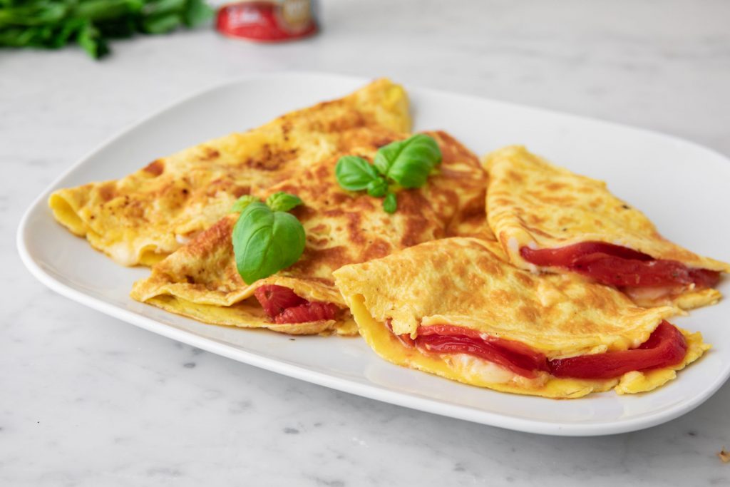 OMELET WITH BRIE CHEESE AND MARINATED TOMATOES OMELET WITH BRIE CHEESE AND MARINATED TOMATOES